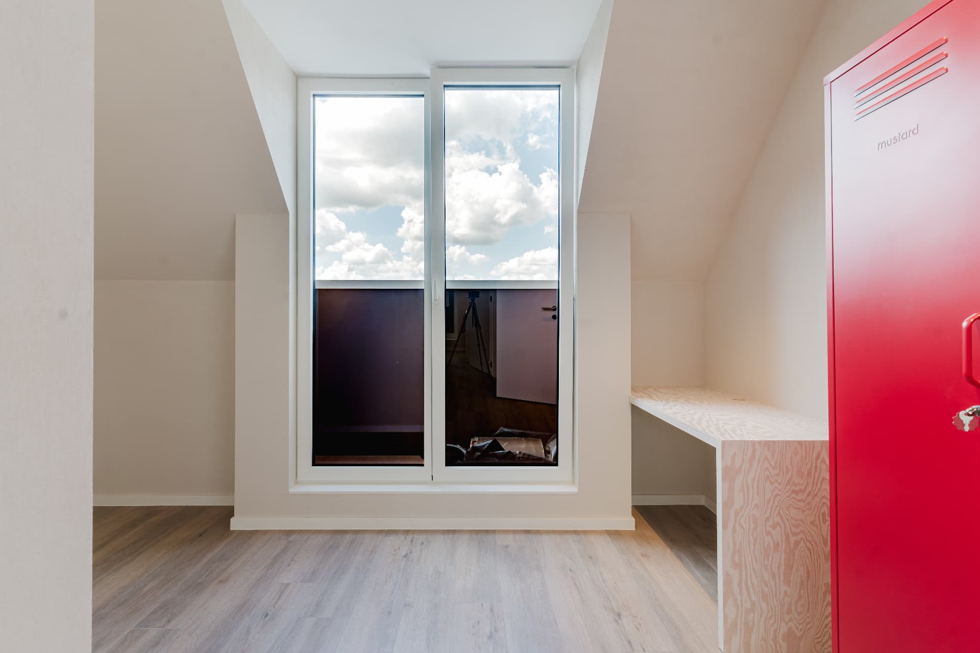 Attic room with the red locker door